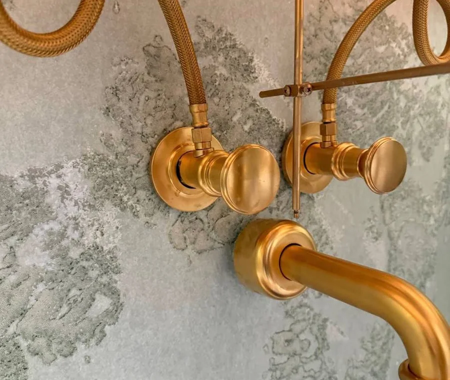 Brushed gold wall mounted faucet plumbing installation by ECH Plumbing