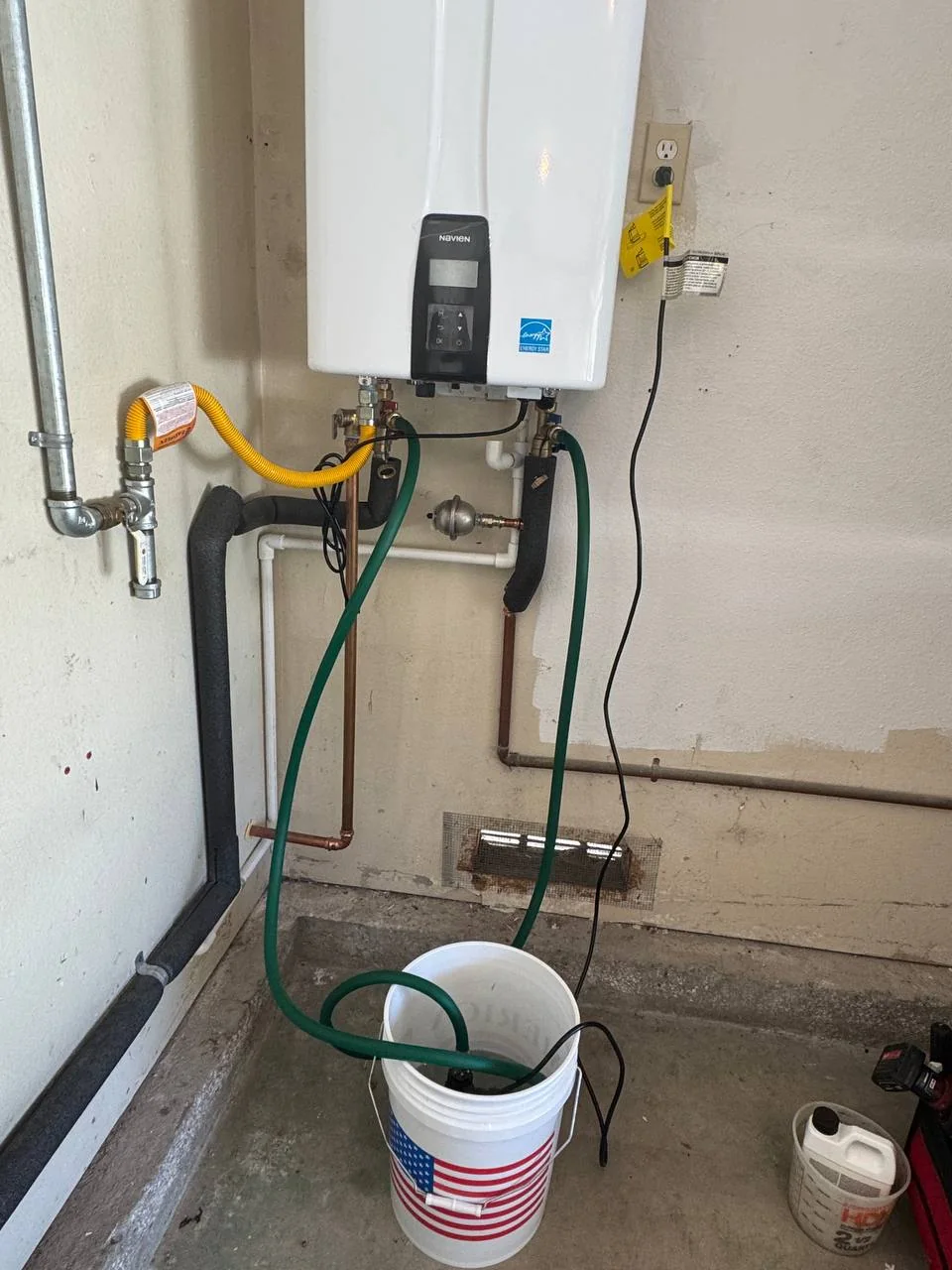 Tankless water heater maintenance setup with service hoses